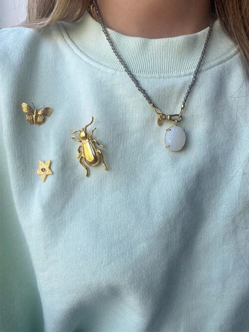 Broche goldplated Kever