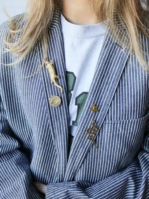 Broche goldplated Slang